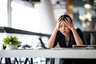 woman holding her head in frustration 