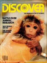 The cover image of the December 1980 issue of Discover Magazine, showing a photo of an newborn monkey held by a pair of human hands wearing surgical gloves