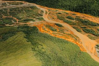 orange water flowing through arctic rivers 