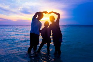 Silhouette of happy family on vacation