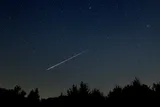 A meteor streaking across the night sky 