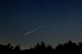 A meteor streaking across the night sky 