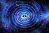 Two black holes colliding and causing ripples 