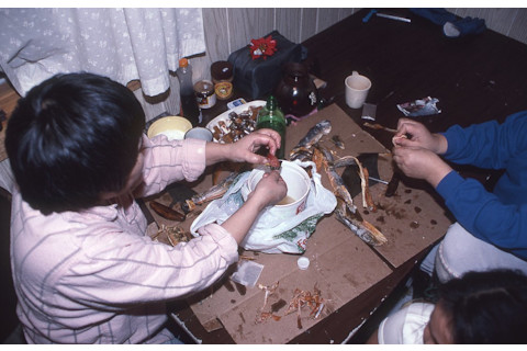 Inuit dipping dried fish