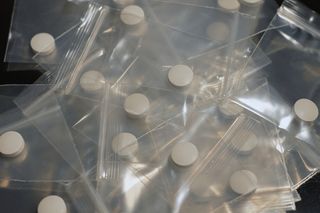 white pills in baggies