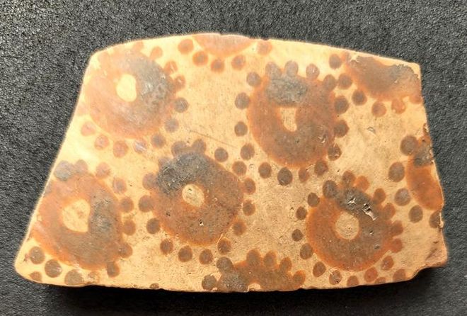 Shard of ancient vase with florals