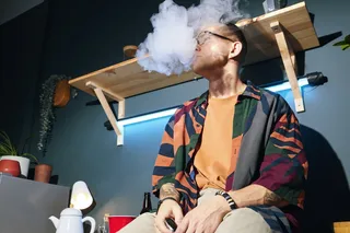 Person smoking indoors, could create thirdhand smoke Person smoking indoors, could create thirdhand smoke