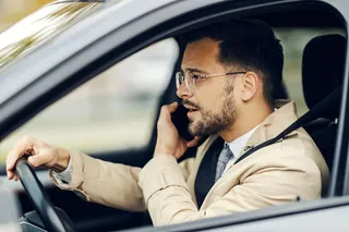 man on the phone while driving