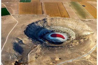 A sink hole created by water bankruptcy 
