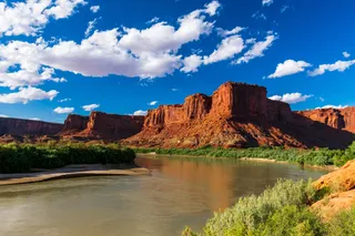 the green river flowing through a canyon 