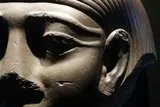 close up of an Egyptian face statue 