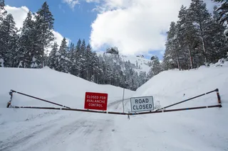 A road leading up to the mountain is closed due to avalanche warning. 