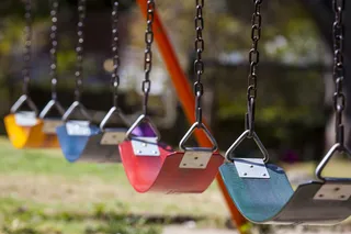 Row of empty swings at a park