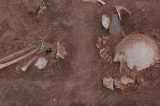 Archaeological site of Iron Age, showing details of human skeleton