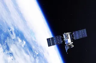 A space satellite, resembling NASA’s Van Allen Probe A, orbits earth 