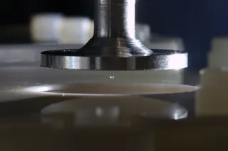 acoustic levitation device with a single sphere suspended mid air.