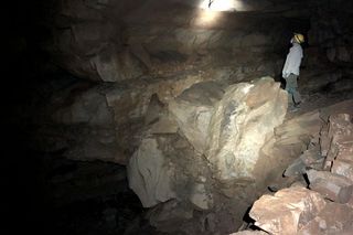 Person searching for fossils inside mammoth cave
