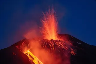 Mount Etna erupting, lava shown