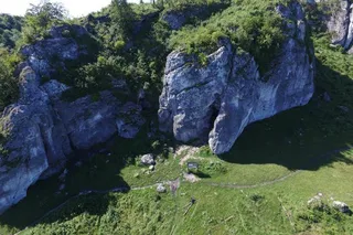 Aerial view of Stajnia Cave in Poland, where Neanderthal teeth were discovered and analyzed for ancient DNA.