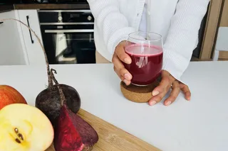 Person drinking beetroot juice