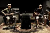 Musicians Mike Gordon, left, and Bob Weir, right, participating in study on synchronizing