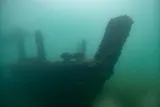 Sunken ship in murky water