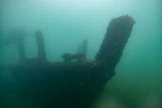 Sunken ship in murky water