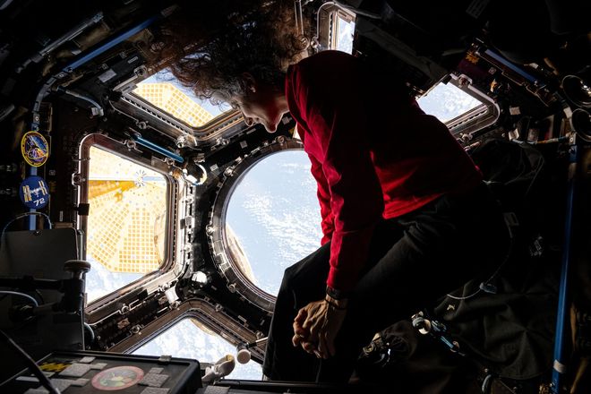 Sunita Williams looks down on Earth from the ISS Sunita Williams looks down on Earth from the ISS