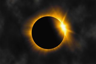 total solar eclipse blocking out the sun 