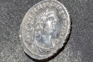 Silver roman coin with Roman Emperor Carausius face on it