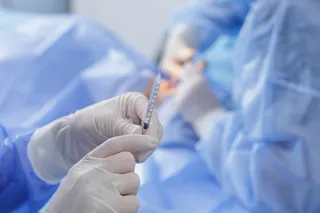 Medical professional giving local anesthesia