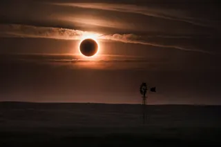 Solar Eclipse over a farm