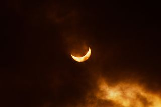Total solar eclipse partially covered