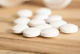 White pills on a table, which could be Metformin pills