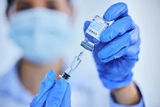 Medical professional giving a COVID-19 vaccination 