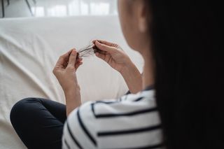 Woman pulls out hair, could be trichotillomania