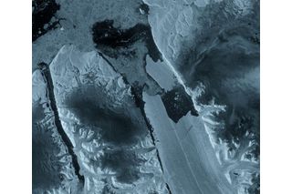 satellite image of a piece of ice breaking away from a glacier