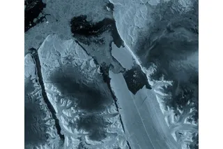 satellite image of a piece of ice breaking away from a glacier