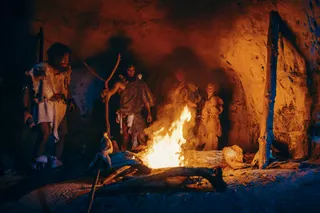 ancient humans around a fire