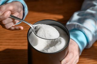 xylitol being scooped with a spoon