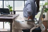 Person sitting in a desk chair