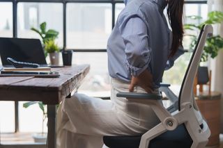 Person sitting in a desk chair