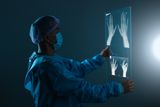 doctor looking at hand x ray t