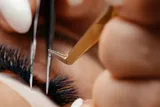 Person getting eyelash extensions, close-up