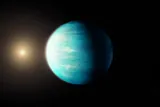 greenish-blue exoplanet near its star 