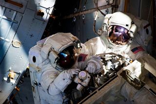 Two astronauts in space