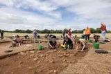 Archeologists digging up ancient Roman villa wall 