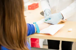Woman getting a blood test possibly for breast cancer