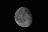 the moon partially covered in shadow
