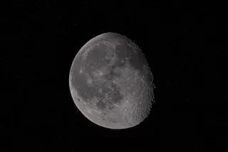 the moon partially covered in shadow